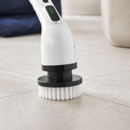Close view of the round cleaning head attached to the white electric scrubber