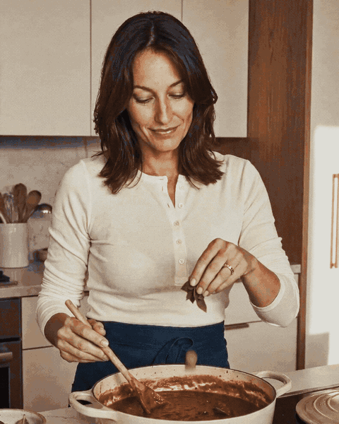 Woman preparing food, then using the Mason Jar Vacuum Sealer with a mason jar in a home kitchen